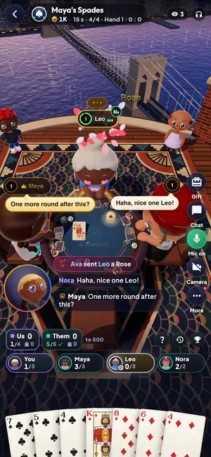 Friends playing Spades on a New York rooftop in Masa: one talks on voice chat, another sends him a rose, and chat bubbles pop up over the table